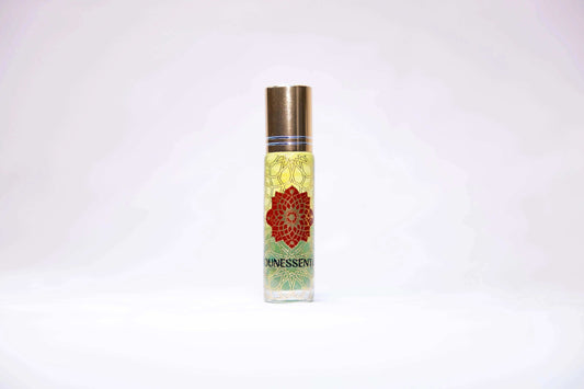 Clear glass roll-on perfume bottle with gold cap, red mandala label, Ounessenti brand, peridot-infused eucalyptus scent