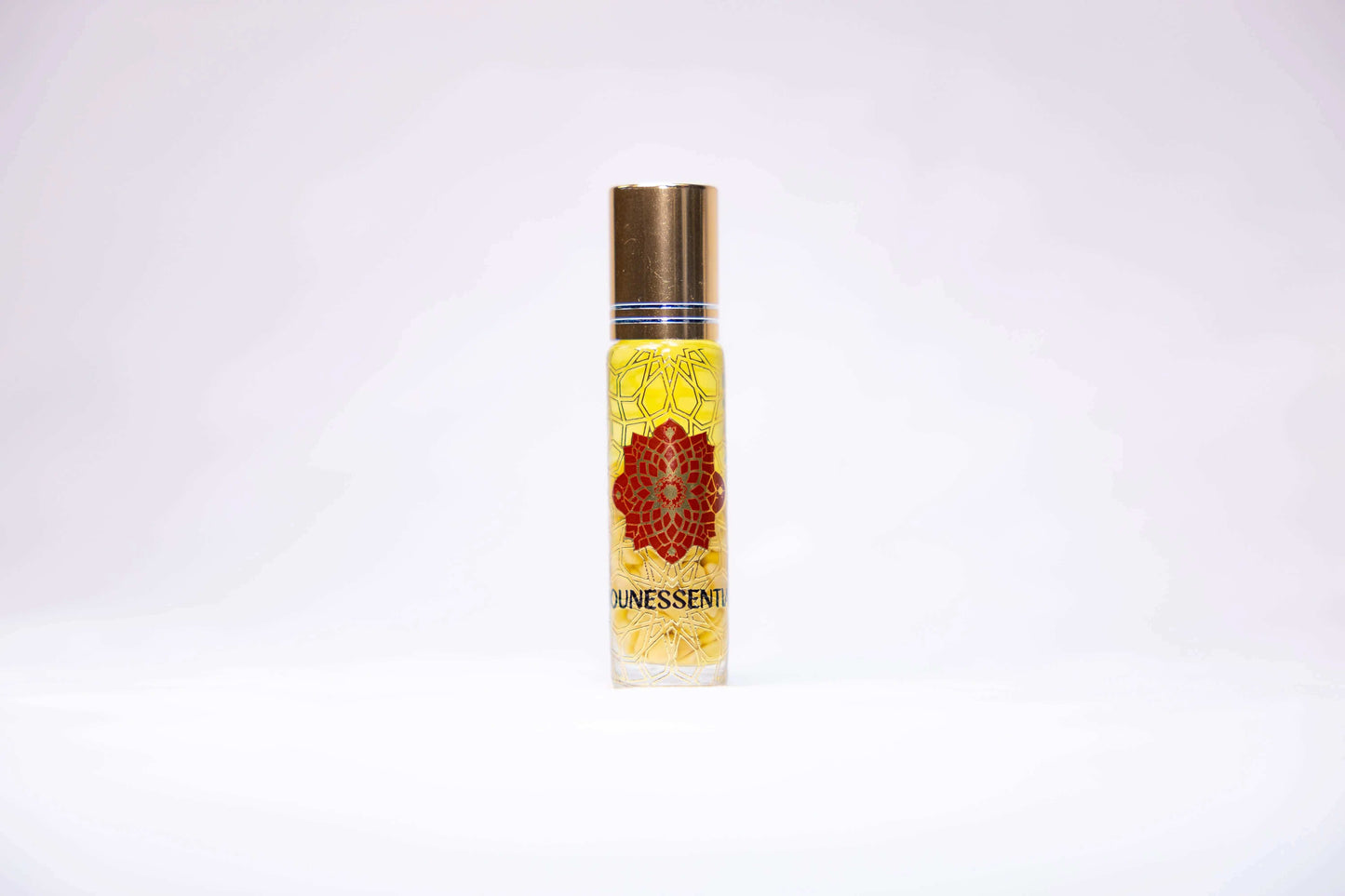 Frankincense and Yellow Jade Infusion Roll-On perfume bottle with floral design