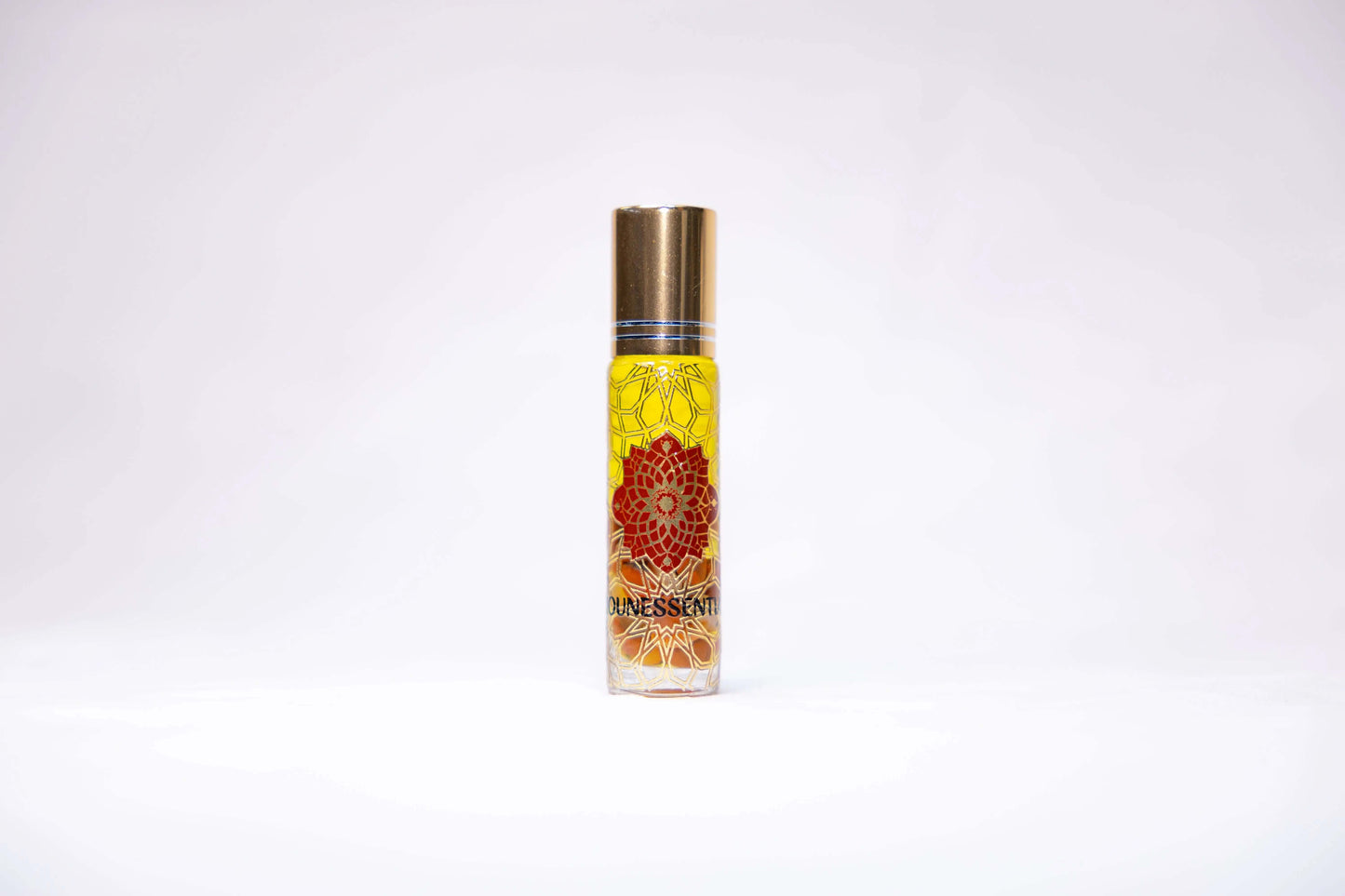 Golden-capped dunessent rollerball perfume with neroli and carnelian infusion