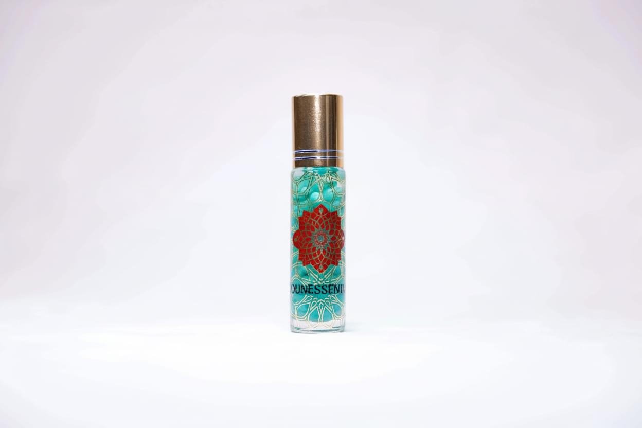 Clear glass roll-on perfume bottle with gold cap, Helichrysum and turquoise infusion body roll on
