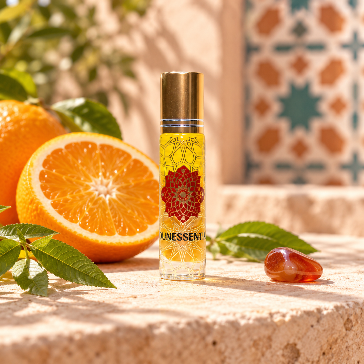 Sweet Orange and Carnelian Infusion Body Roll-On styled in a realistic sunlit citrus Moroccan-inspired setting