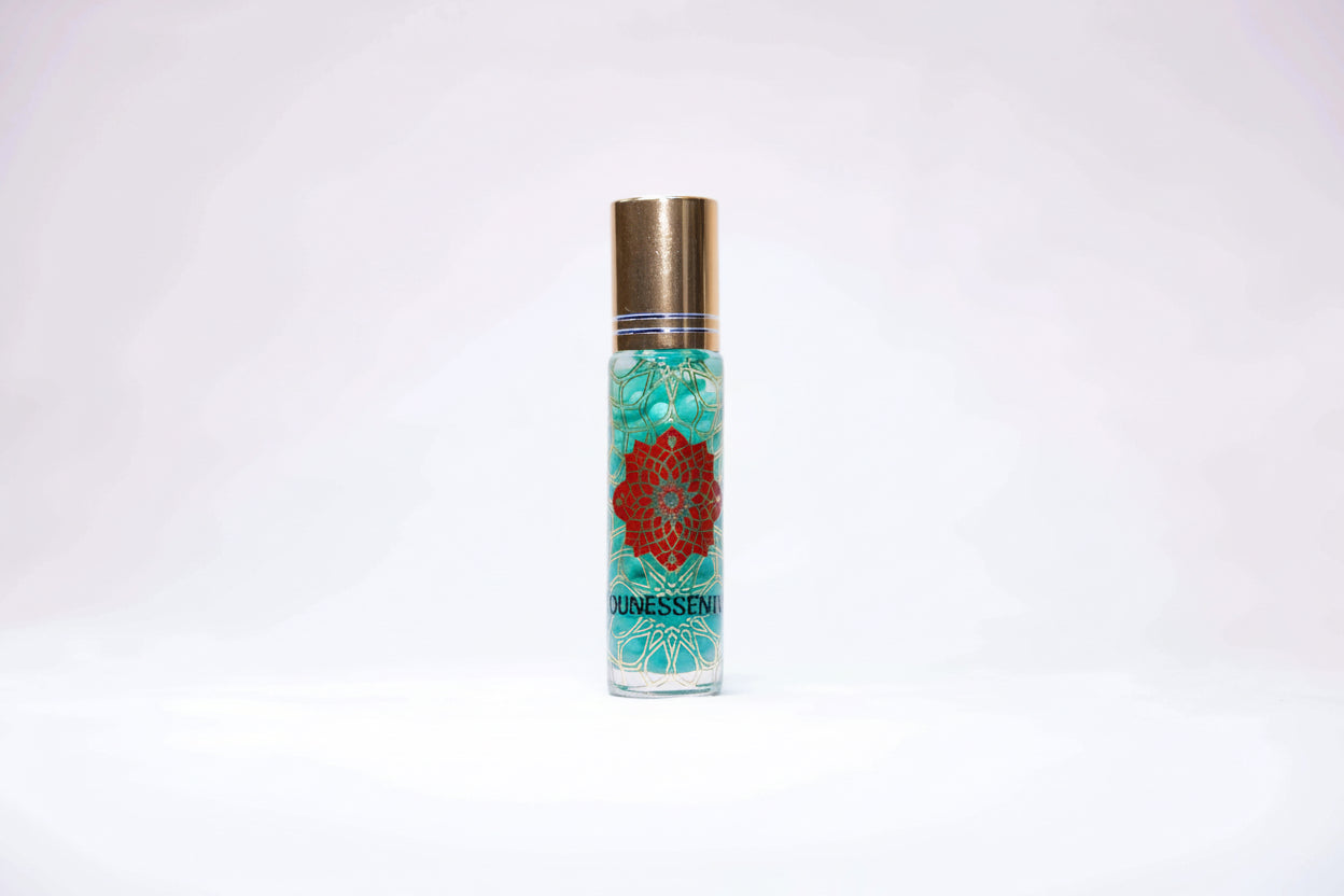 Clear glass roll-on perfume bottle with gold cap, Helichrysum and turquoise infusion body roll on