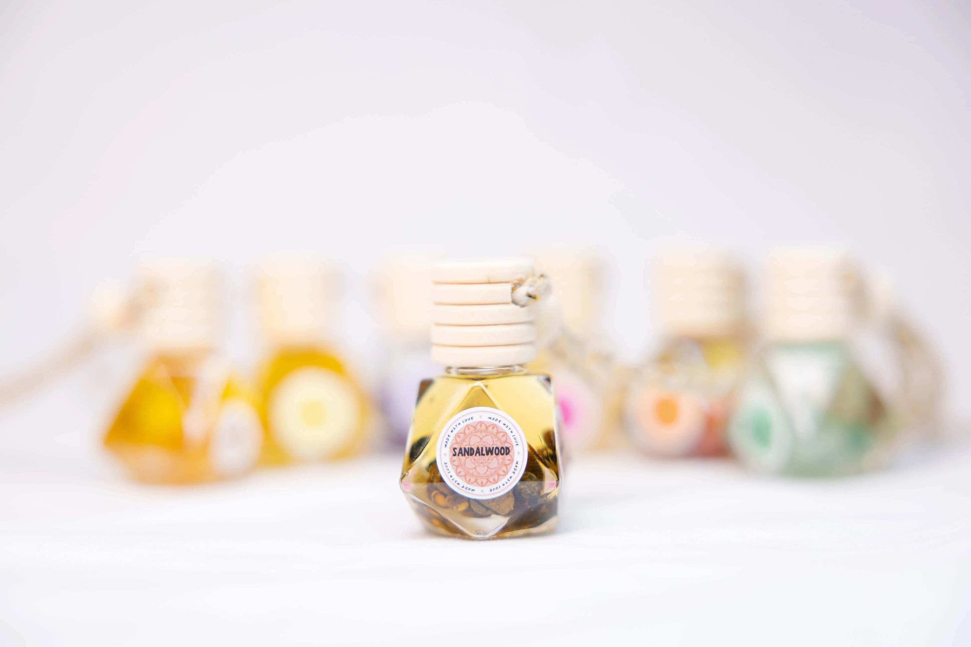 Sandalwood essential oil car diffuser in clear glass bottle